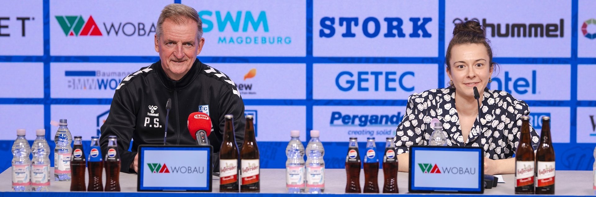 Trainer Petrik Sander (links) und Pressesprecherin Kristina Richter